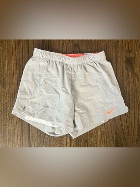 Nike Women's Light Gray Athletic Shorts with Coral Swoosh